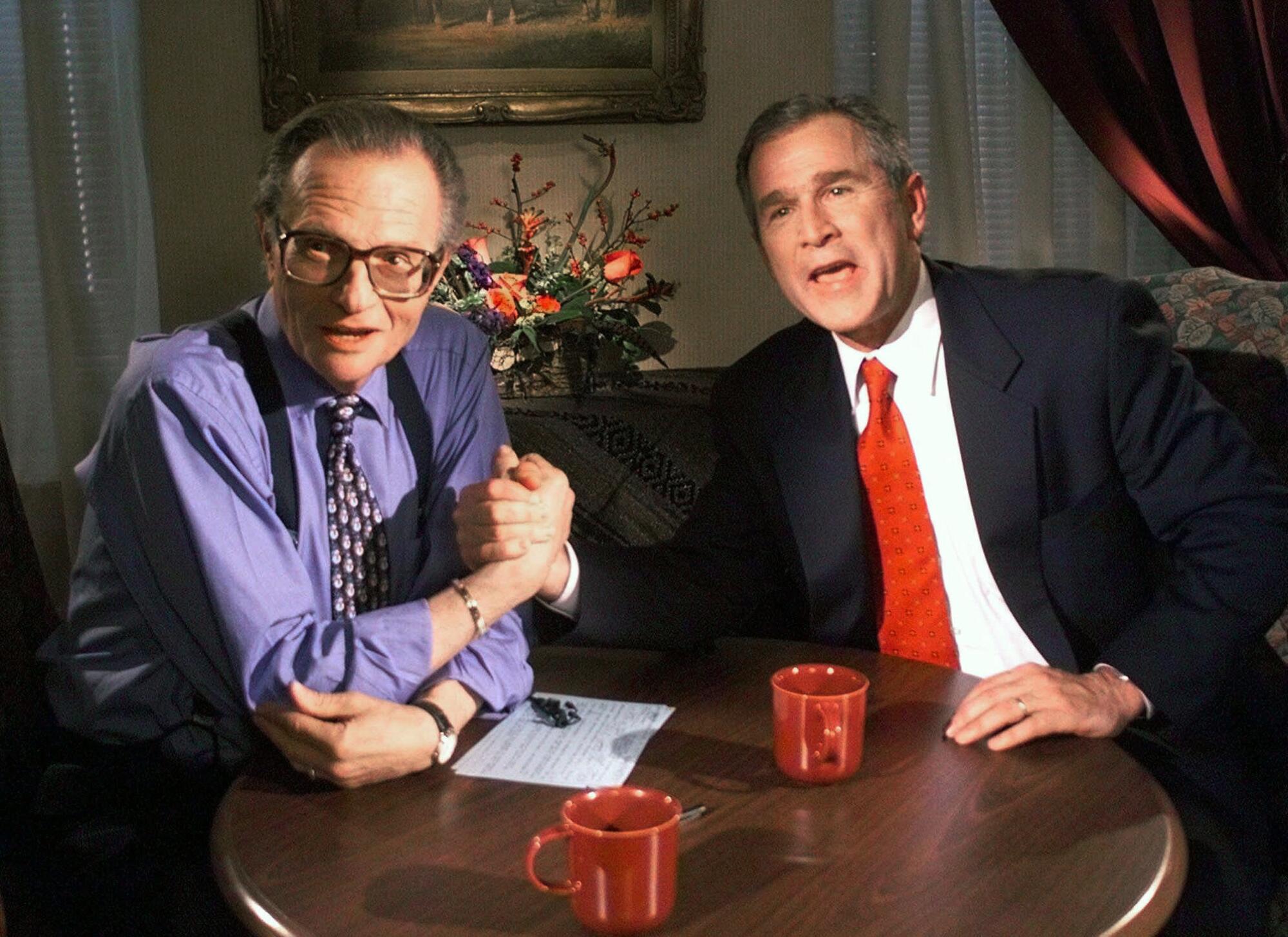 Republican presidential candidate Texas Gov. George W. Bush jokes with CNN's Larry King in 1999
