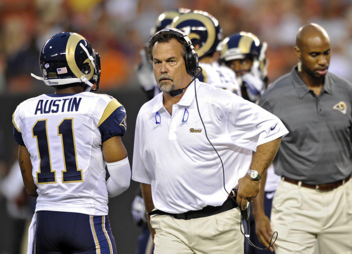 Rams Coach Jeff Fisher walks back to the sidelines after an injury in the preseason game against the Browns on Thursday night.