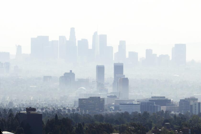 LOS ANGELES, CA - MARCH 31, 2021 - - The downtown Los Angeles skyline is shrouded in haze as seen from The Getty Center in Los Angeles on March 31, 2021. (Genaro Molina / Los Angeles Times)