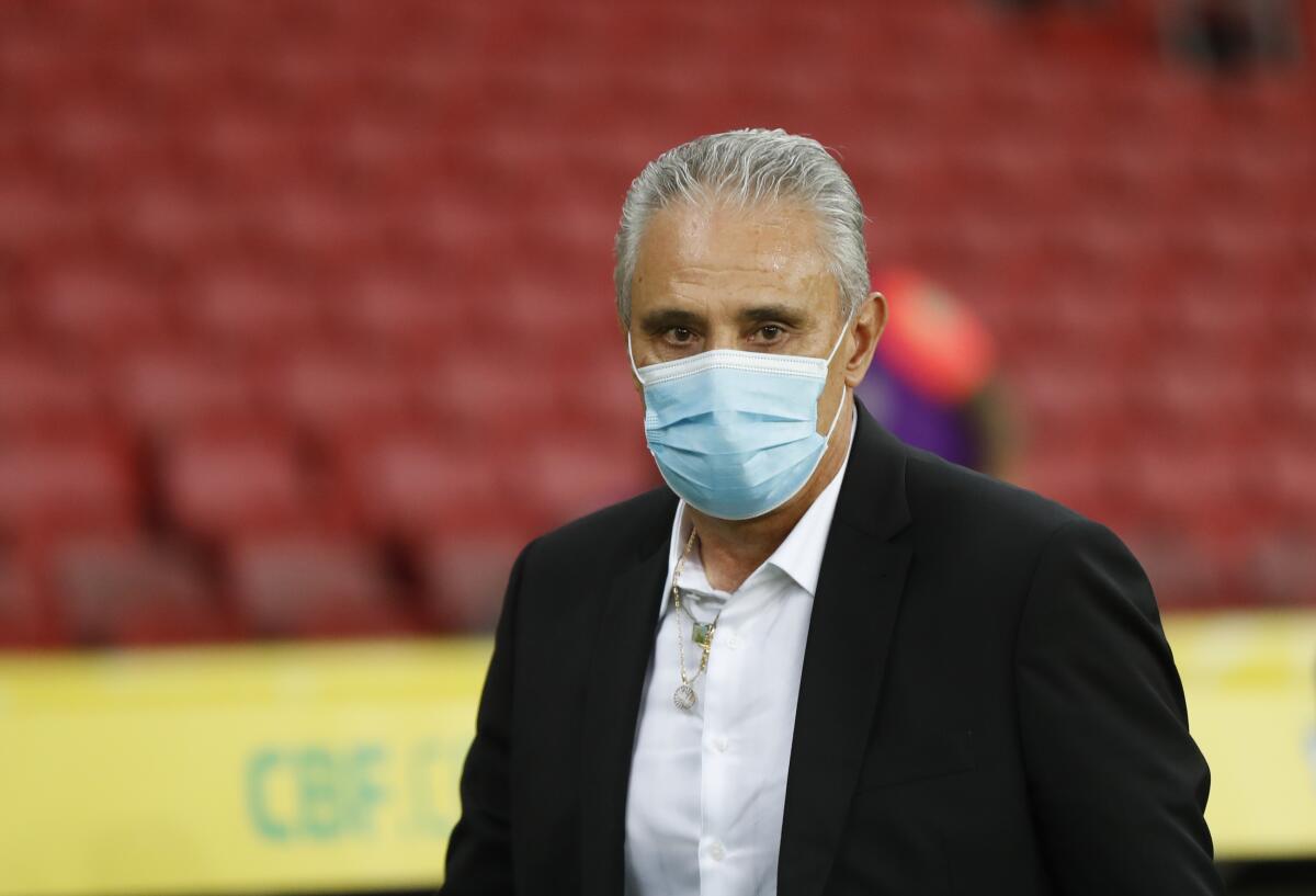 Brazil's coach Tite looks on prior a qualifying soccer match against Ecuador for the FIFA World Cup Qatar 2022 at Beira-Rio stadium in Porto Alegre, Brazil, Friday, June 4, 2021. (AP Photo/Andre Penner)