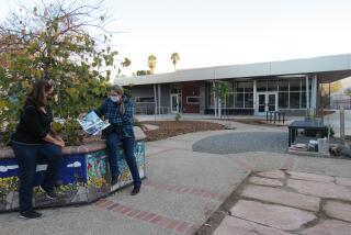 Cuyamaca College instructor Diane Citrowske (right) talks to Ornamental Horticulture student Tricia Daley.