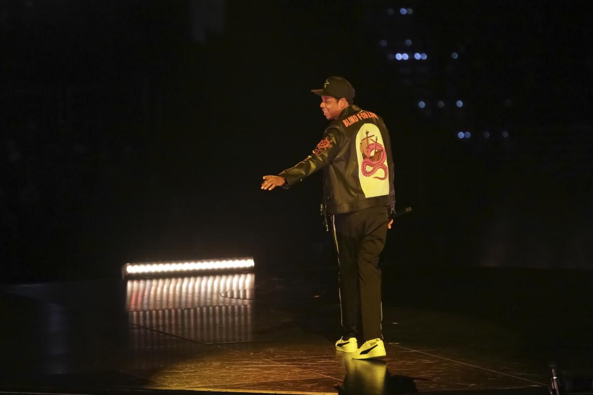 On his 4:44 Tour, Jay-Z, wearing a Gucci jacket, performs onstage at Capital One Arena on Nov. 29, 2017, in Washington, D.C.