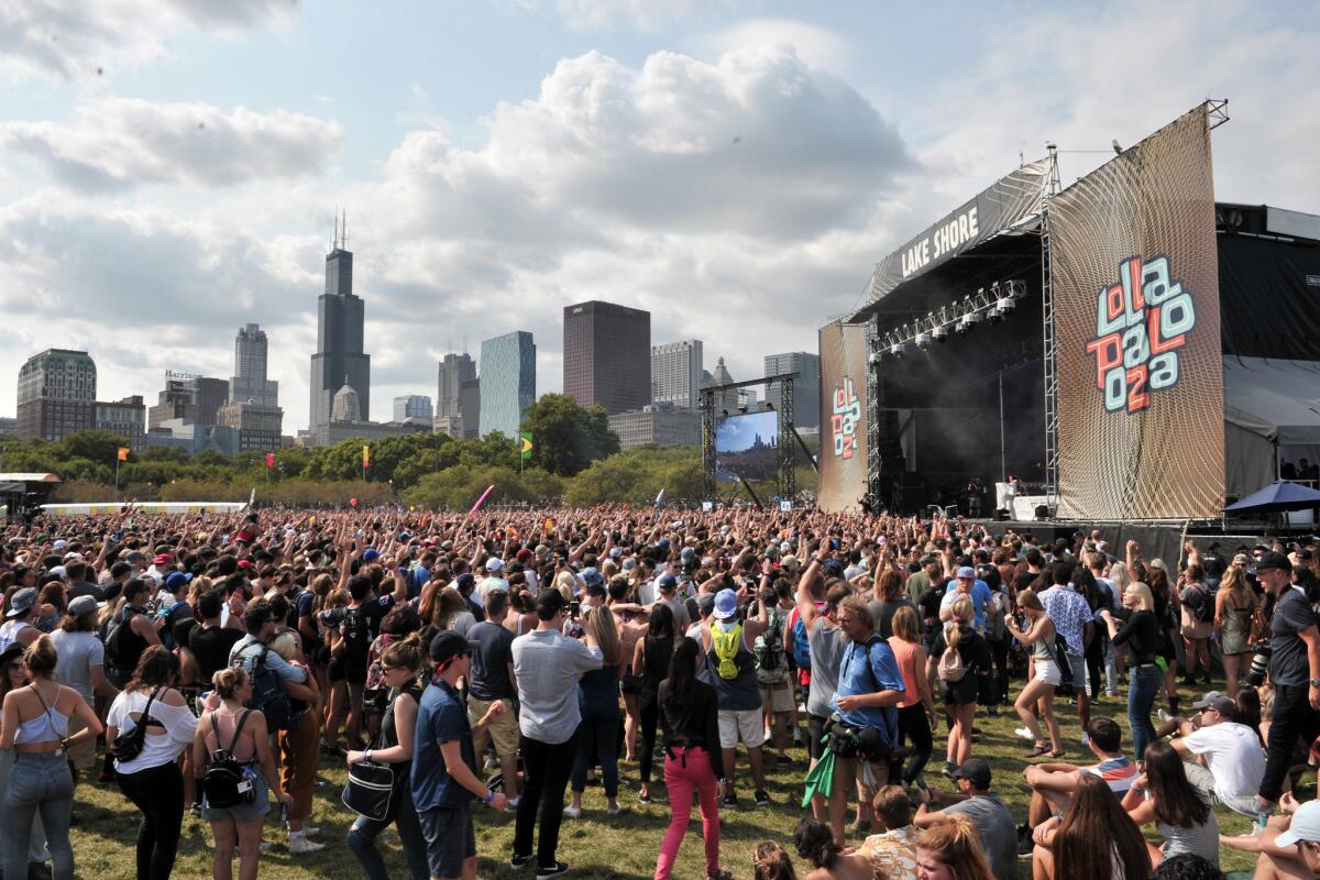 Fans watch as Charli XCX performs at Lollapalooza in Chicago's Grant Park on Aug 6.