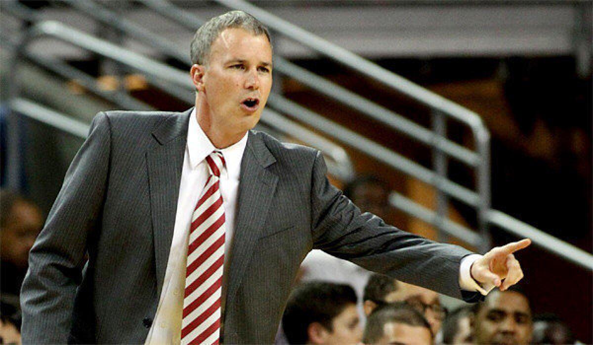 USC Coach Andy Enfield and University of Texas-El Paso Coach Tim Floyd got into a heated verbal exchange during a dinner ahead of the schools' participation in the Battle 4 Atlantis tournament in the Bahamas, according to a Sports Illustrated report.