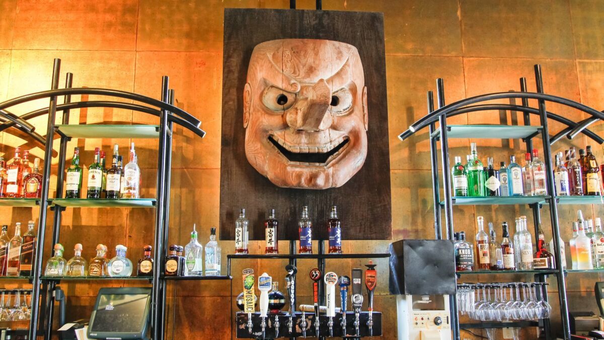 Café Japengo's once-bustling bar has long-featured a carved, Japanese Tengu mask. With the UTC-area restaurant's announced closure after nearly 30 years, regular customers have been asking to buy the mask, with one offering $3,000 for it.