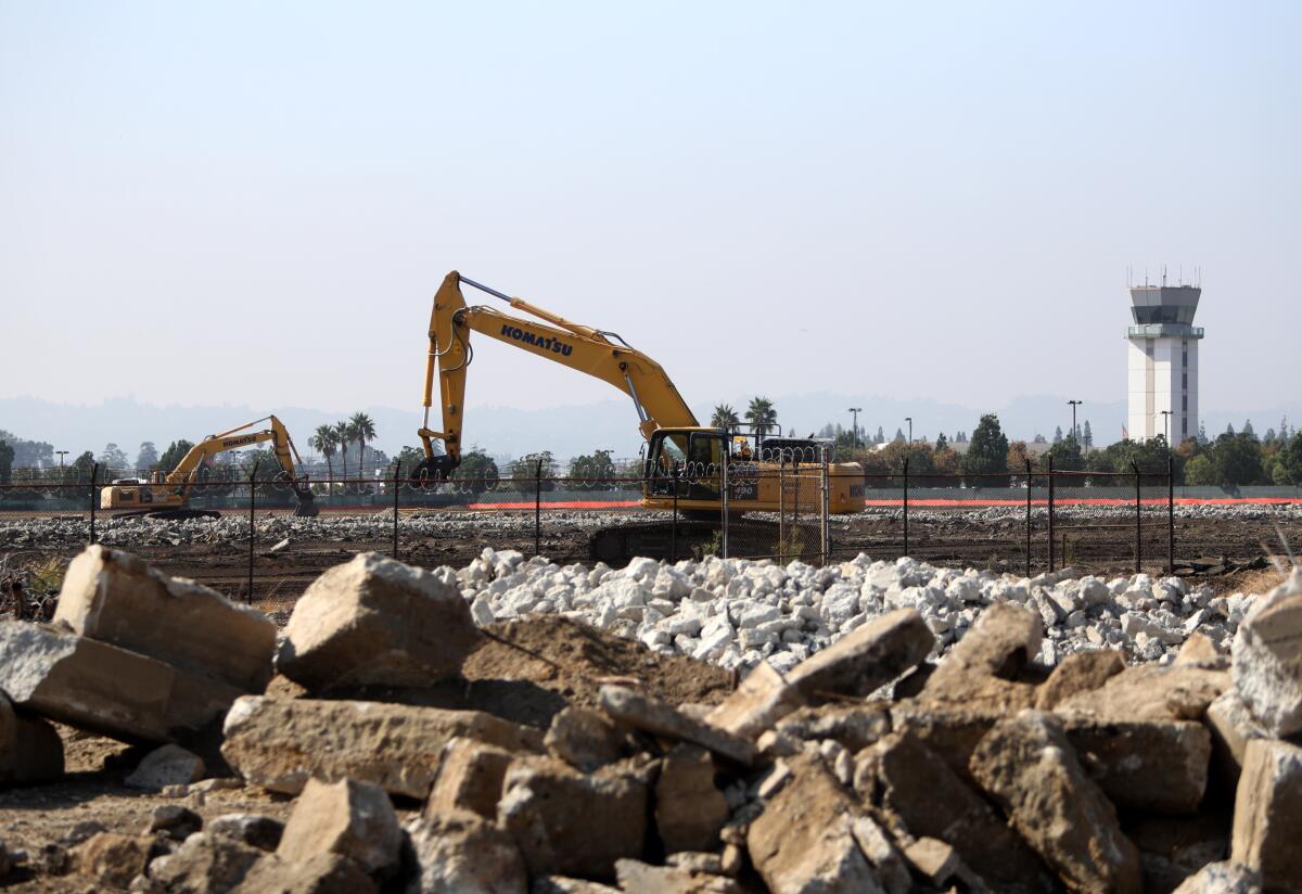 Construction equipment works at the Avion Burbank project, a mixed-use creative industrial park north of the Hollywood Burbank Airport, that is planned to have 18 buildings, during a groundbreaking ceremony by Overton Moore Properties in Burbank on Wednesday.