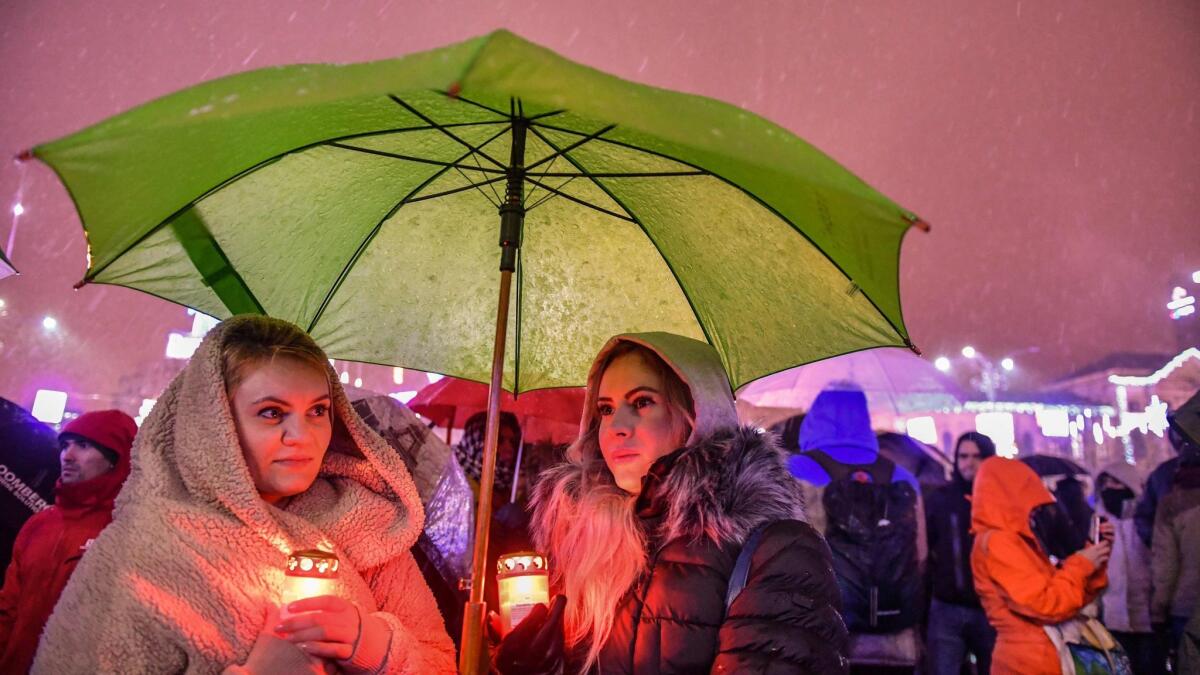 Women take part in a demonstration in support of the judicial system and against recent law adjustments adopted by the ruling coalition on Dec. 17, 2017, in front of the government headquarters in Bucharest, Romania.