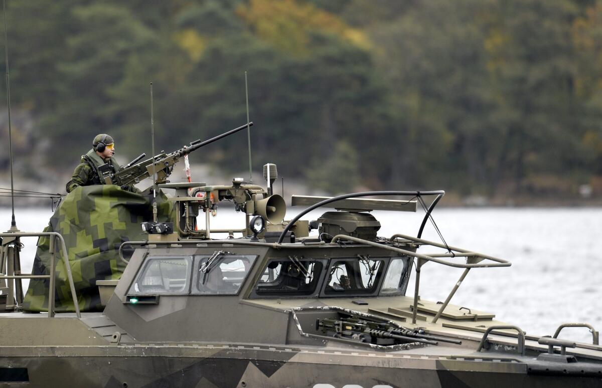 A Swedish navy vessel patrols in the Stockholm archipelago on Oct. 18 as the military conducts a massive search for a foreign undersea intrusion, suspected to be a Russian submarine.