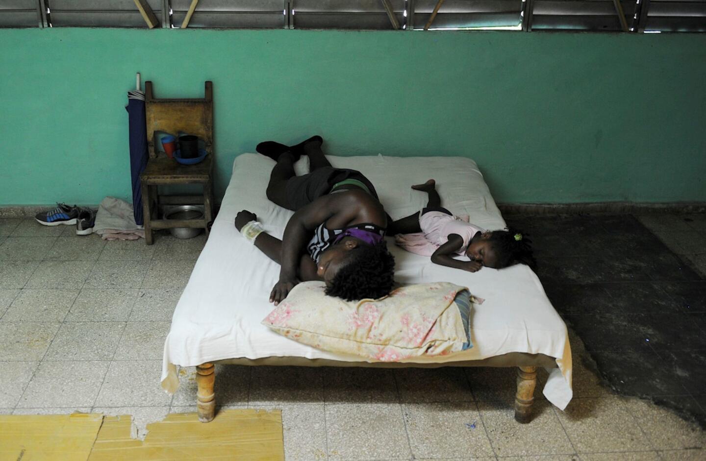 People sleep at a shelter in Guantanamo city, Cuba, on Oct. 4, 2016 ahead of the arrival of Hurricane Matthew.