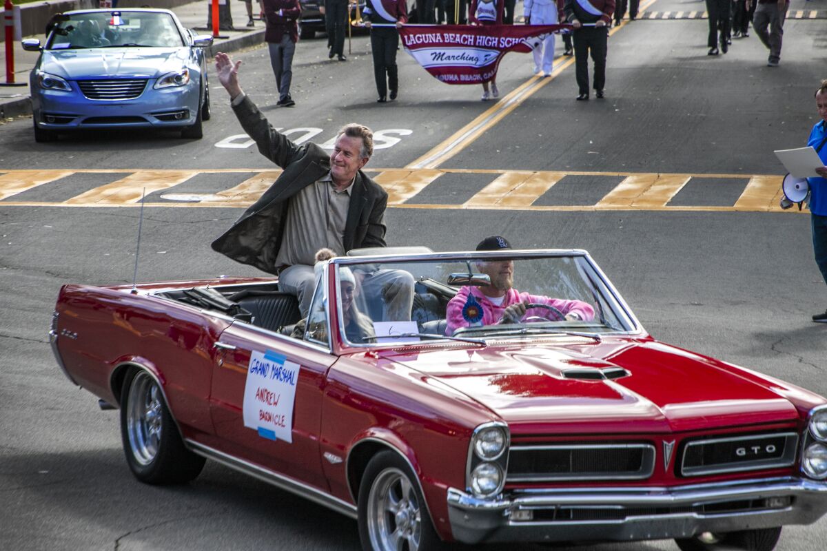 Parade Grand Marshal Andrew Barnicle in a classic Pontiac GTO.