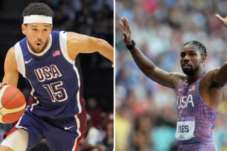 Devin Booker of the U.S. men's basketball team, left, and U.S. sprinter Noah Lyles