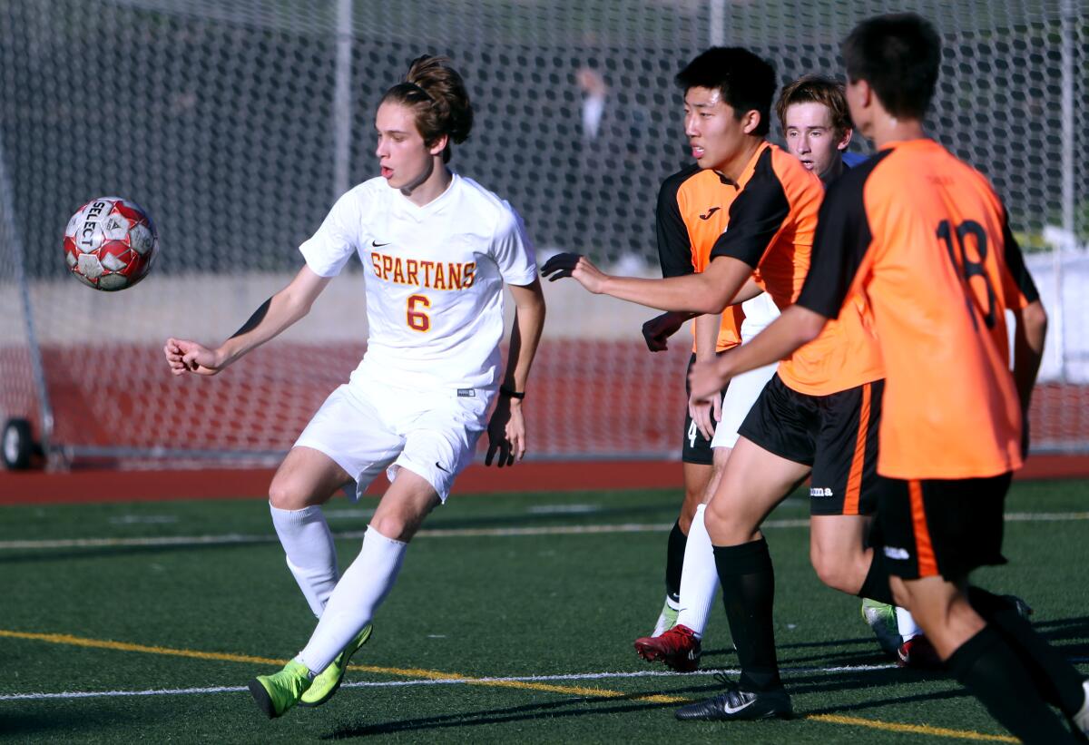 La Cañada's Marcus Chmielewski, left, seen here in a file photo, scored a hat trick in the Spartans' 4-2 win over South Pasadena Friday.