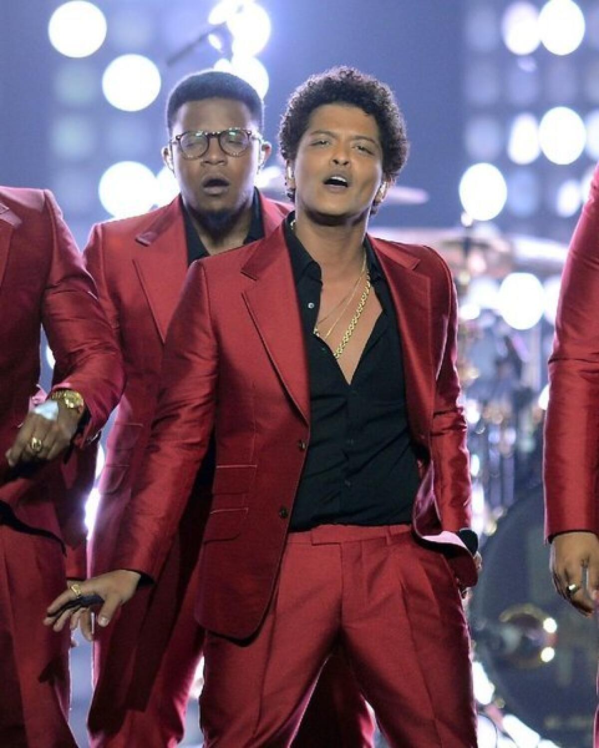 Bruno Mars performs onstage during the 2013 Billboard Music Awards. Italian luxury brand Dolce & Gabbana has announced it is outfitting him for his world tour, which kicks off this weekend in Washington, D.C.