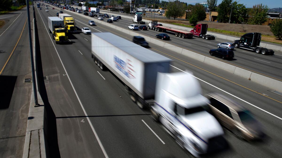 Trucks and cars on Interstate 5 near the Port of Tacoma in Washington.