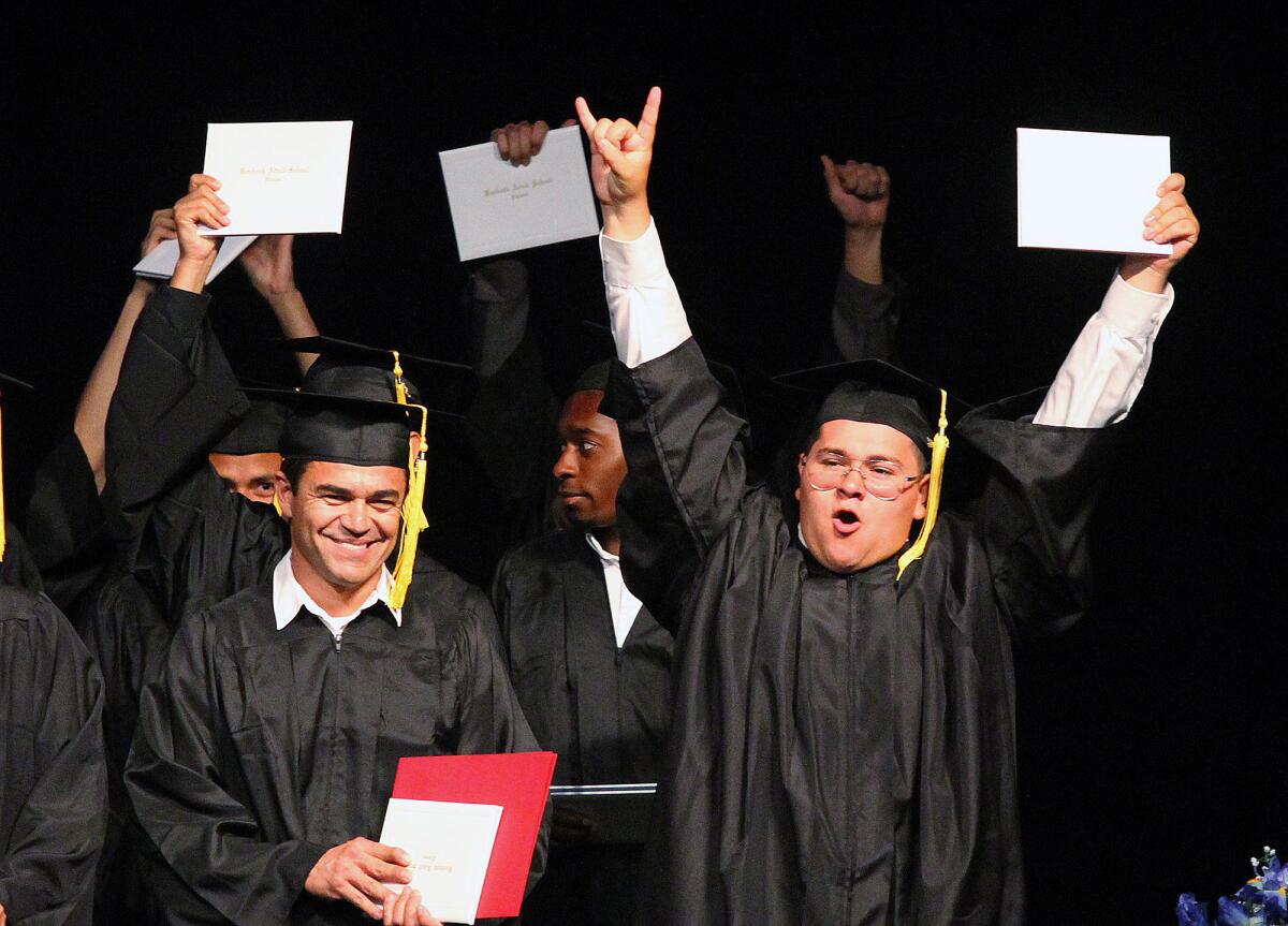 Graduates of the Burbank Adult School celebrate at the conclusion of graduation ceremonies at the graduation at Luther Burbank Middle School on Wednesday, May 28, 2014.