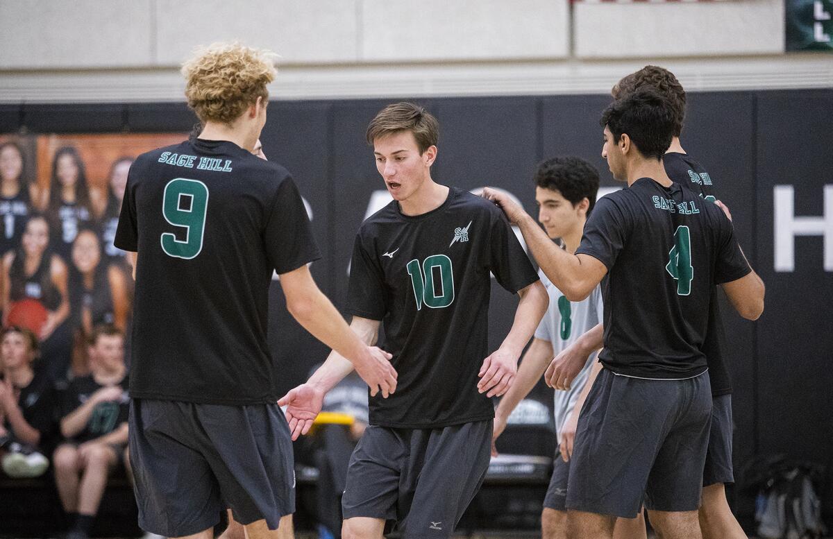 Sage Hill's Connor Martin (9) and Amin Sajjadian (4) congratulate Jackson Bryant (10) during a nonleague match against Ocean View on Tuesday.
