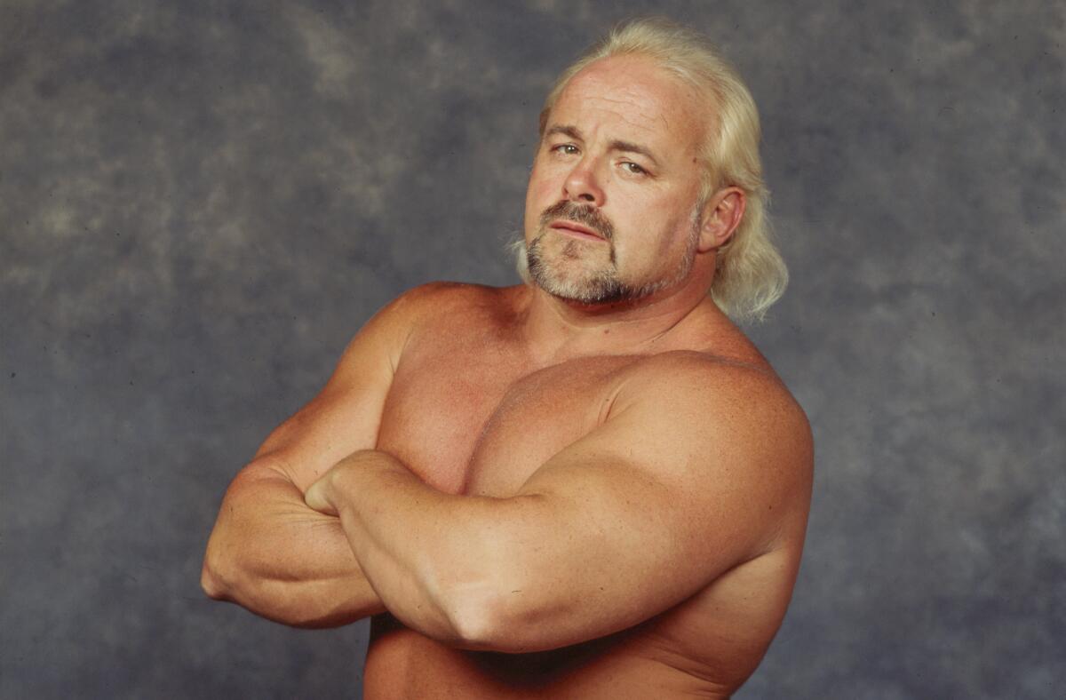 Wrestler Kevin Sullivan poses