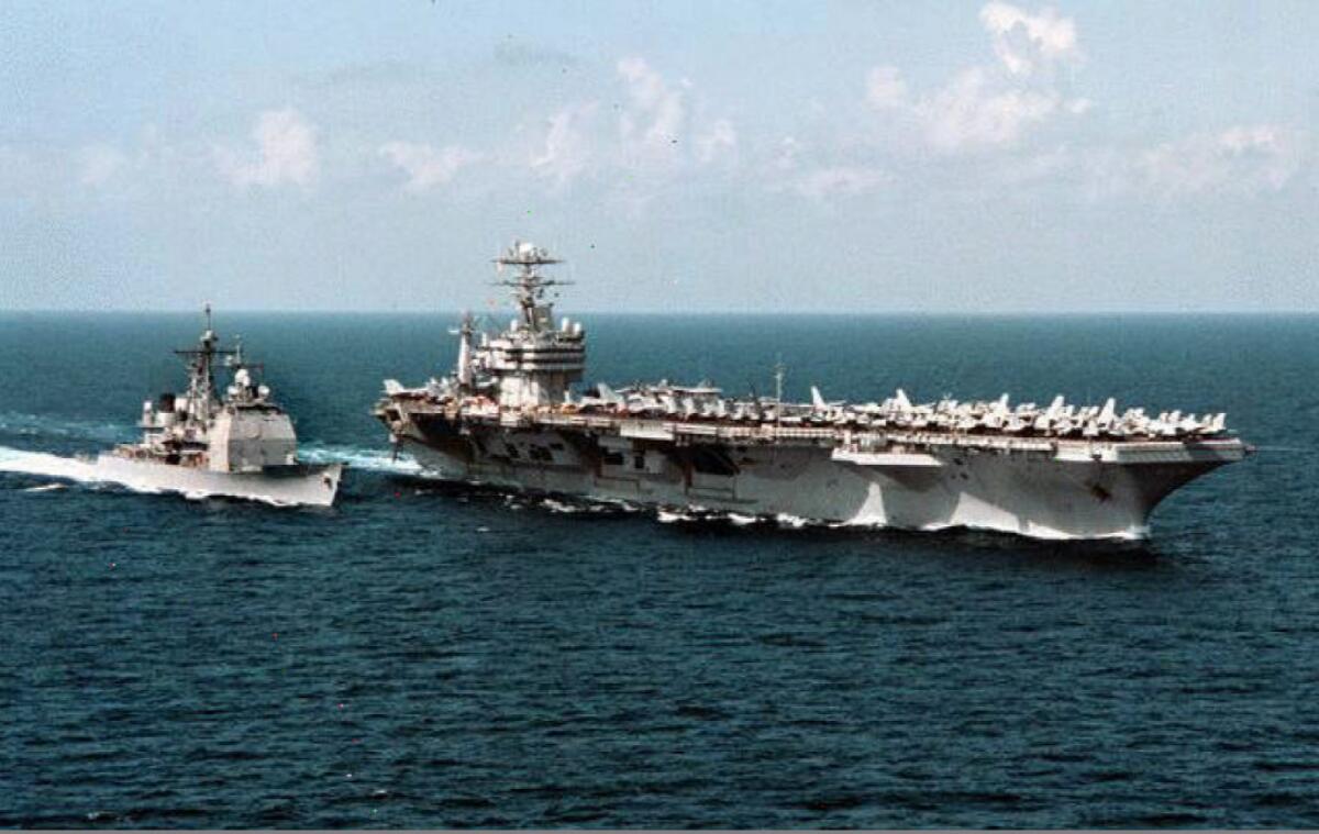 The nuclear aircraft carrier George Washington and her escort ship the USS Normandy underway in the Arabian Sea.