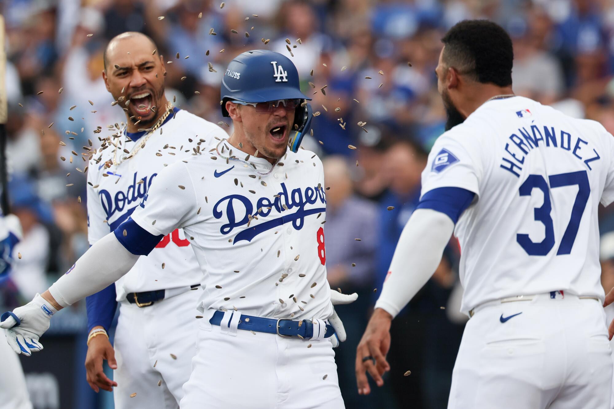 Plaschke: Playoff demons be gone! Dodgers outlast Padres to advance to NLCS 3 Kiké Hernández, center, celebrates with Mookie Betts and Teoscar Hernández after hitting a solo home run for the Dodgers.