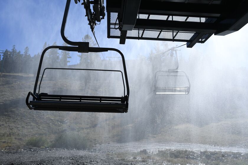 Lake Tahoe, CA. September 1, 2021: Mist from from snowmakers sprays water next to a chairlift as the Caldor fire approaches near the ski resort of Kirkwood Wednesday. (Wally Skalij/Los Angeles Times)
