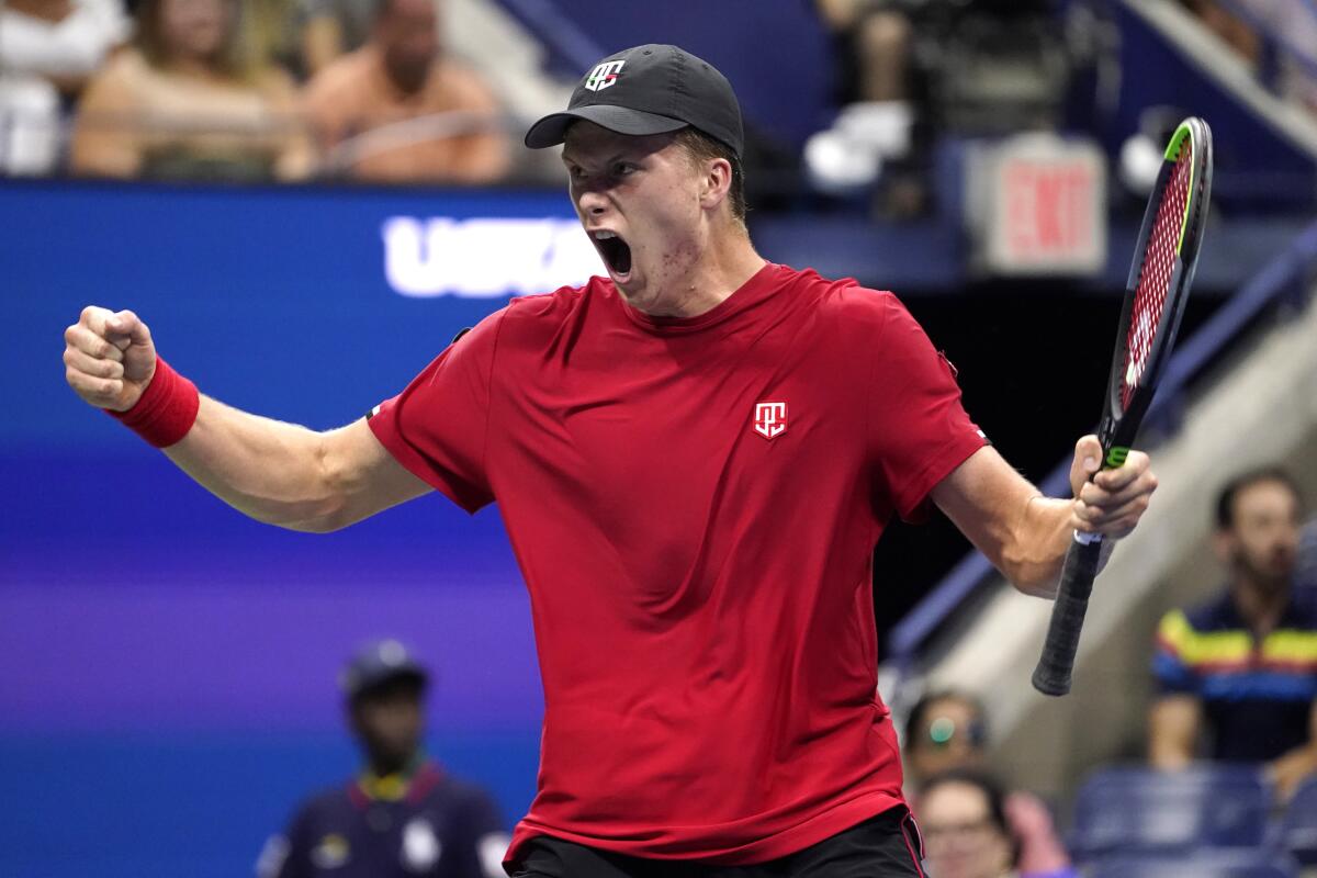 Jenson Brooksby, of the United States, reacts during his match against Novak Djokovic, of Serbia, during the fourth round of the U.S. Open tennis championships, Monday, Sept. 6, 2021, in New York. (AP Photo/John Minchillo)