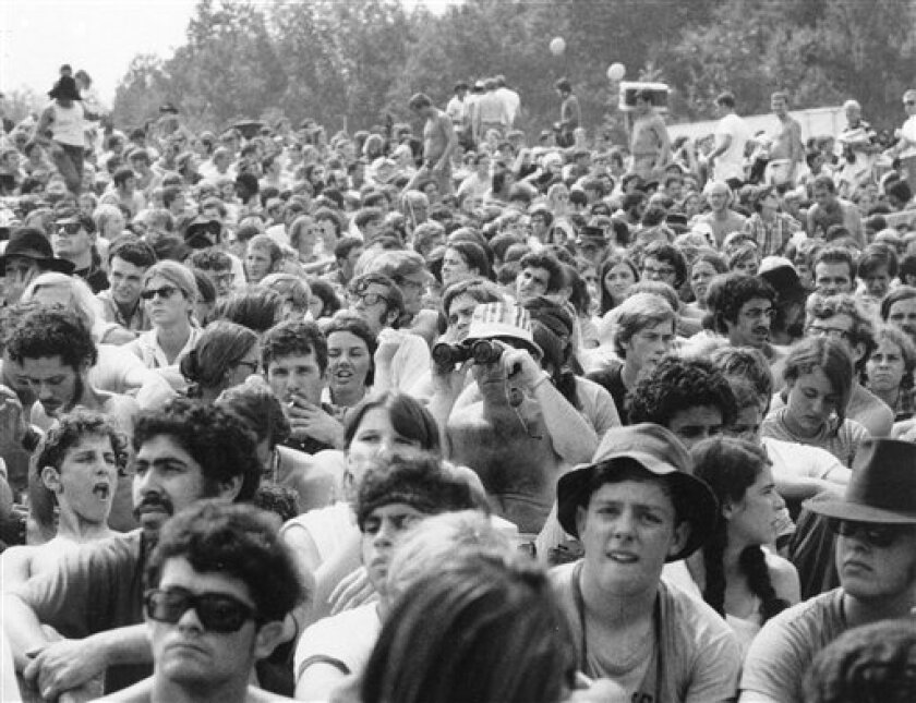 FILE - This 1969 file photo shows the crowd at the Woodstock Music and Arts Festival held on a 600-acre pasture in the Catskill Mountains near White Lake in Bethel, N.Y., (AP Photo, file)