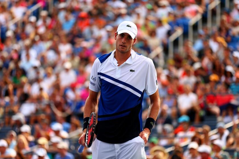 American John Isner lost to Germany's Philipp Kohlschreiber in the third round of the U.S. Open on Saturday.