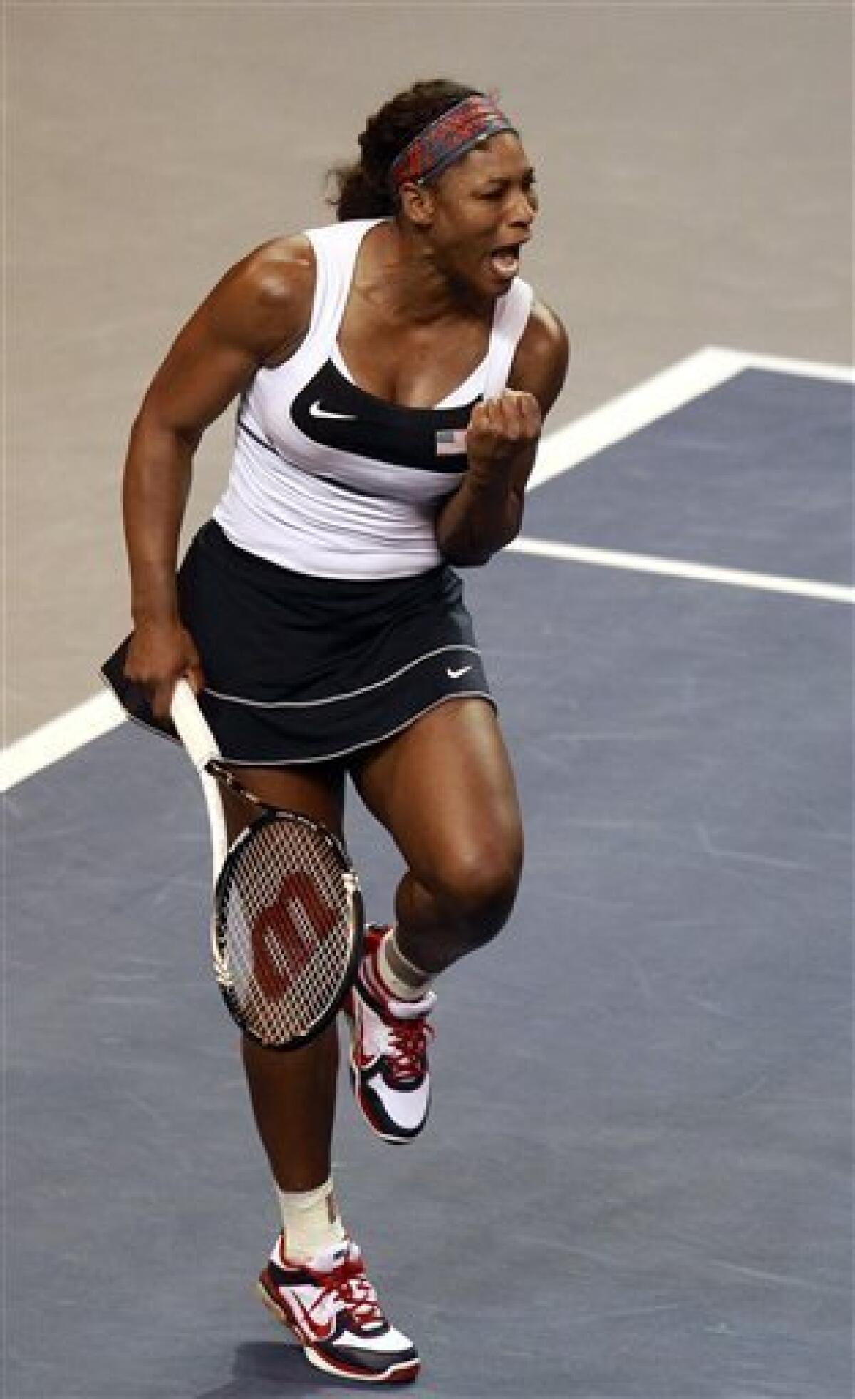 Serena Williams reacts to scoring in the third set of a first-round Fed Cup tennis match against Anastasia Yakimova, of Belarus, in Worcester, Mass., Sunday, Feb. 5, 2012. Williams defeated Yakimova 5-7, 6-1, 6-1. (AP Photo/Steven Senne)