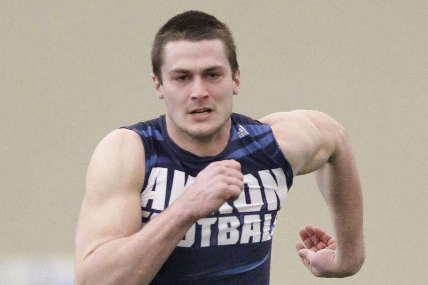 Akron's Andrew Pratt runs the 40-yard dash at a Pro Day college football workout at the University of Akron, Friday, March 18, 2016, in Akron, Ohio. (AP Photo/Tony Dejak)