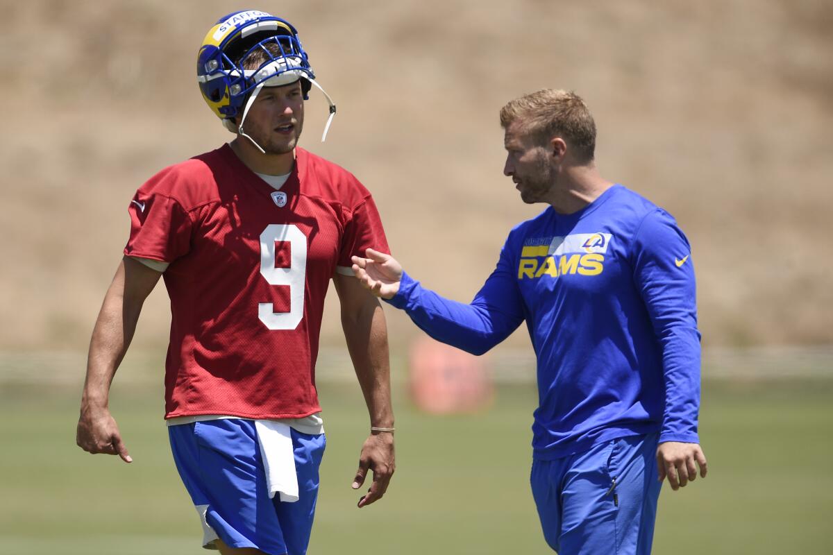 The Rams' Matthew Stafford talks with coach Sean McVay after a practice in Thousand Oaks, Calif., on May 27, 2021.