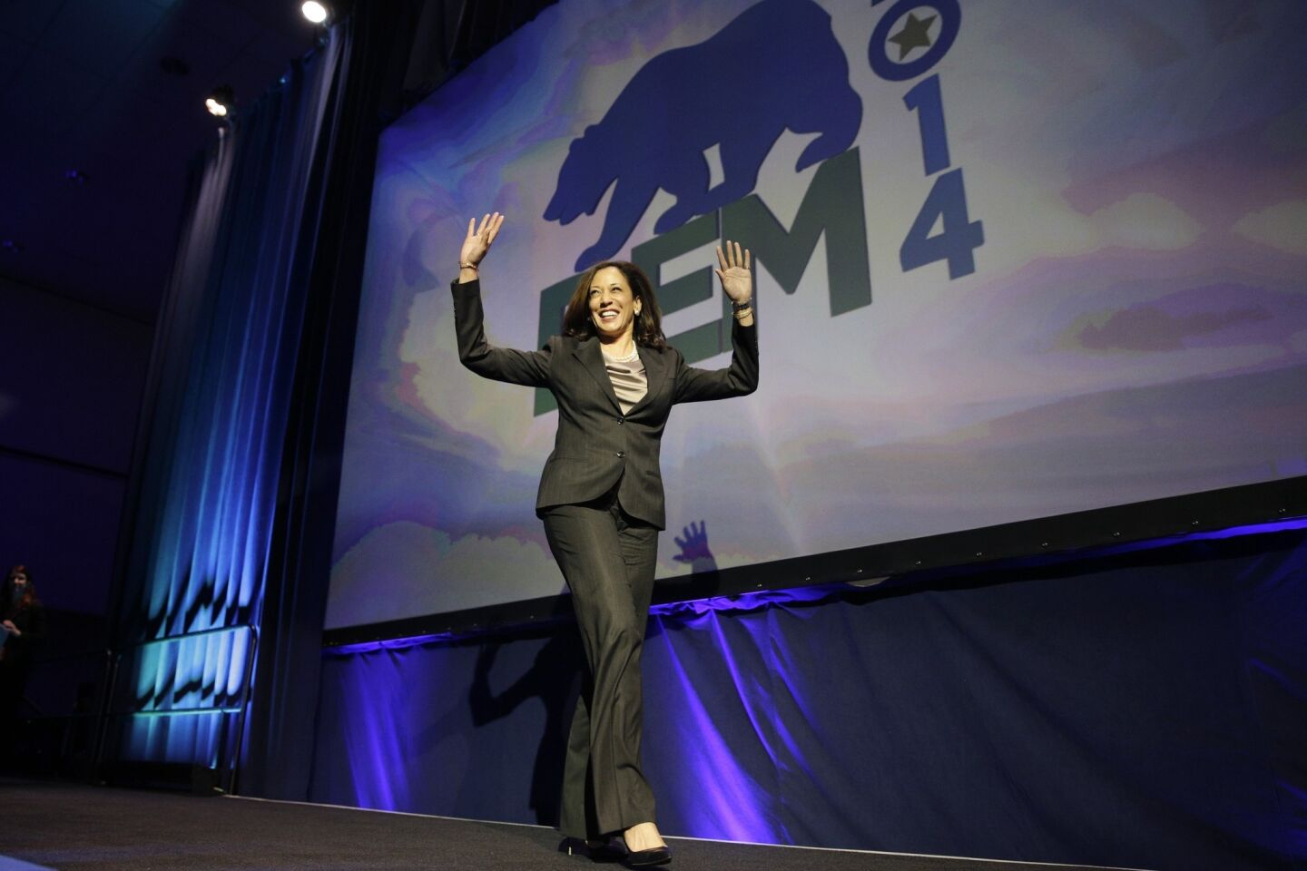 California Atty. Gen. Kamala Harris waves as she walks toward the podium at the party convention.