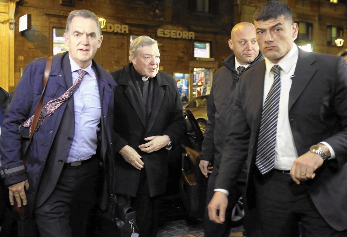Australian Cardinal George Pell, second from left, arrives at a hotel in Rome on March 2 to testify via video link to the Royal Commission Into Institutional Responses to Child Sexual Abuse sitting in Sydney, Australia.