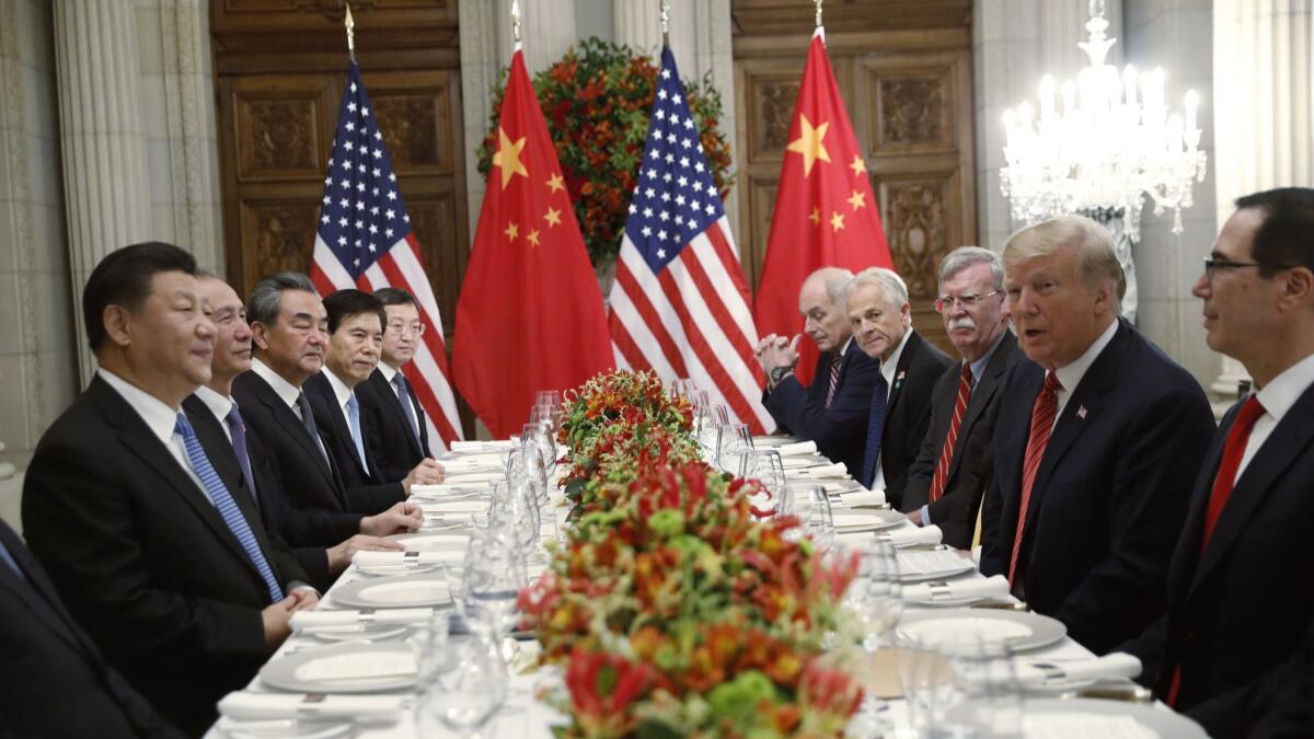 President Trump meets with China's President Xi Jinping, left, during their bilateral meeting at the G20 Summit in Buenos Aires, Argentina, last year. Chinese and U.S. trade negotiators are in contact ahead of an expected meeting at the G-20 summit.