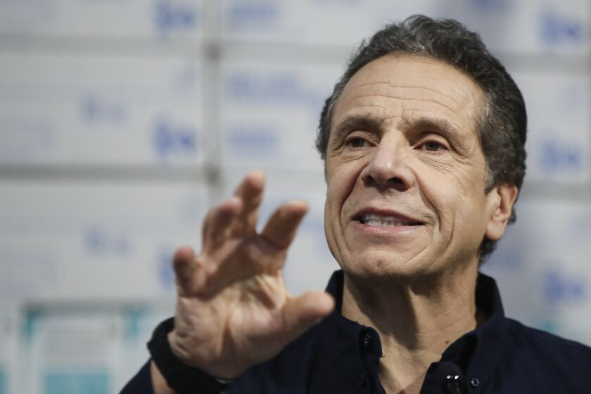 New York Gov. Andrew Cuomo speaks during a news conference at the Jacob Javits Center that will house a temporary hospital in response to the COVID-19 outbreak, Tuesday, March 24, 2020, in New York. (AP Photo/John Minchillo)