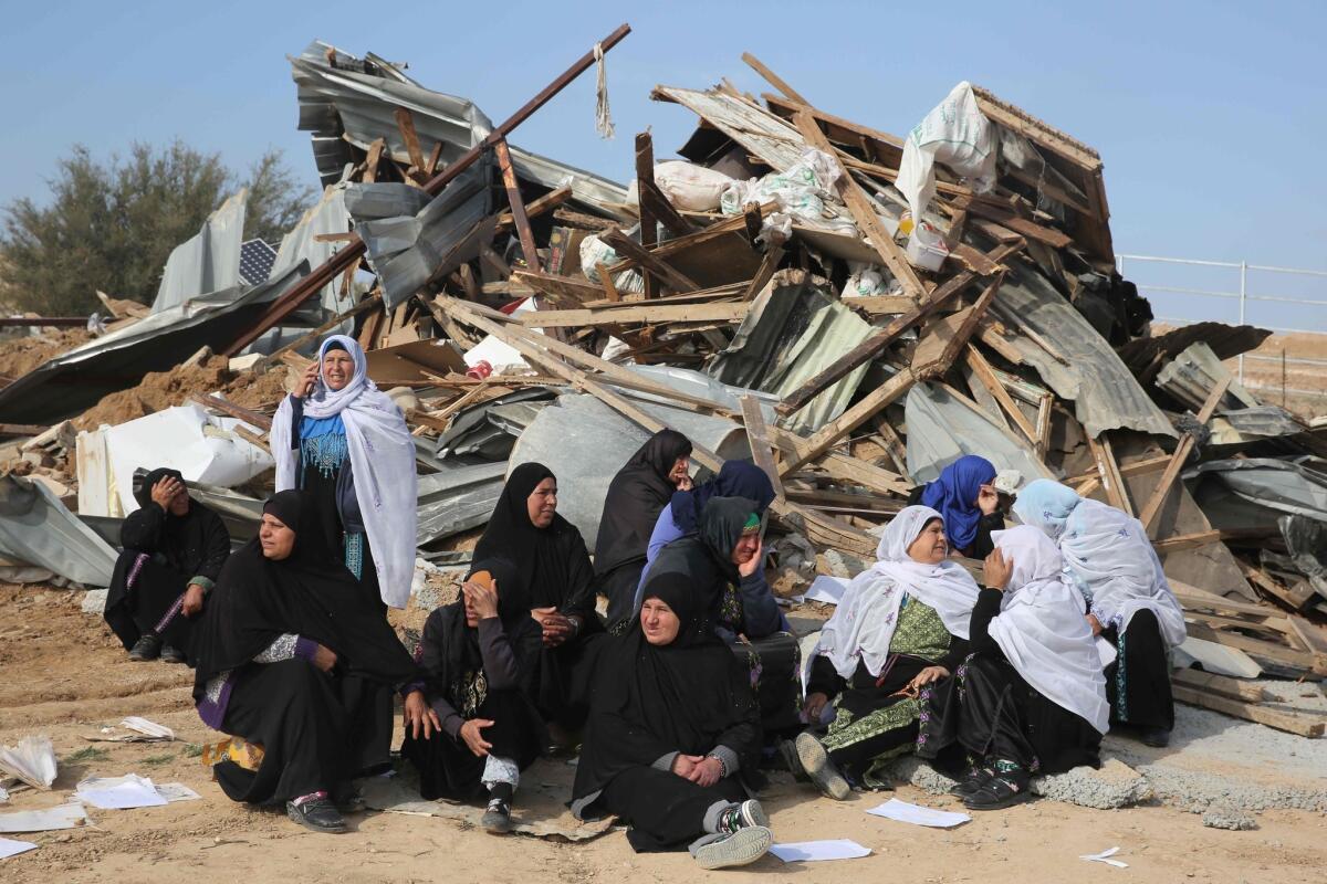 Bedouin women react to the destruction of houses in the Bedouin village of Um al Hiran, which is not recognized by the Israeli government.
