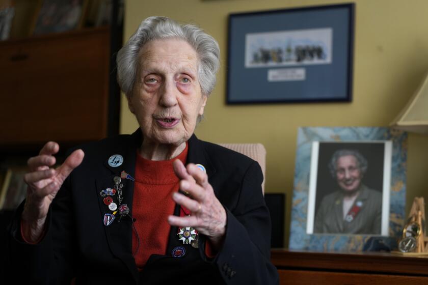 Marie Scott who was a serving Wren and switchboard operator at the time of D-Day, at her home in London, Thursday, April 25, 2024. D-Day, took place on June 6, 1944, the invasion of the beaches at Normandy in France by Alied forces during World War II. (AP Photo/Kirsty Wigglesworth)