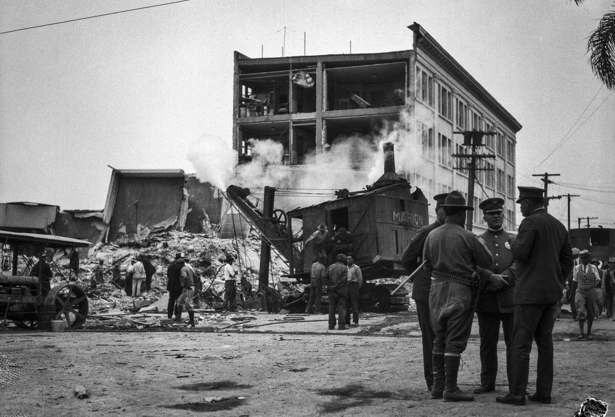 March, 1933: A steam shovel clears building debris after the March 10, 1933, Long Beach earthquake.