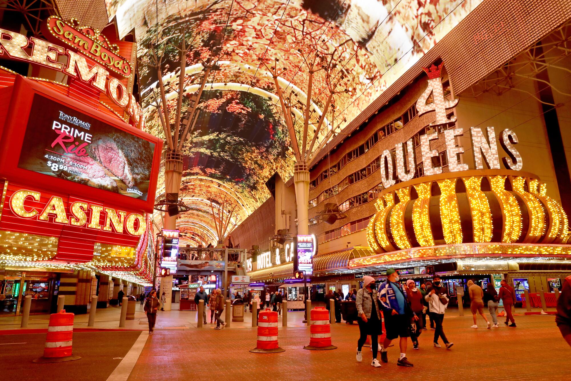 People walk along Fremont Street in downtown in Las Vegas.