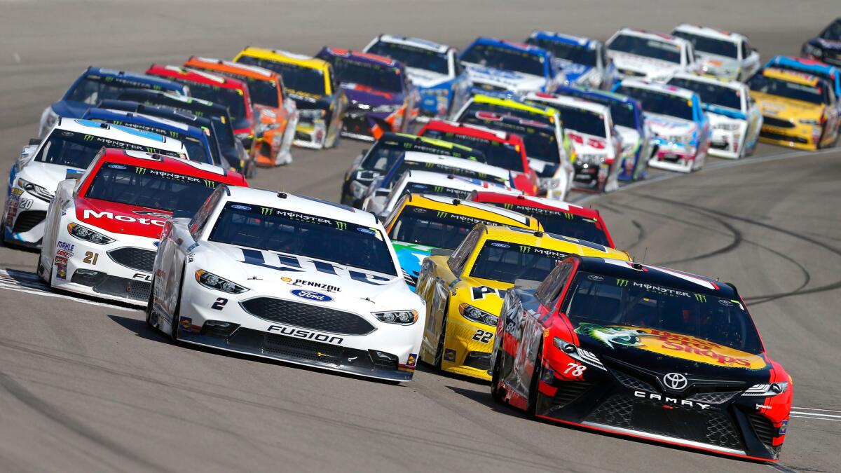 Martin Truex Jr., bottom right, and Brad Keselowski lead the field out of a turn during the Kobalt 400 at Las Vegas Motor Speedway on Sunday.