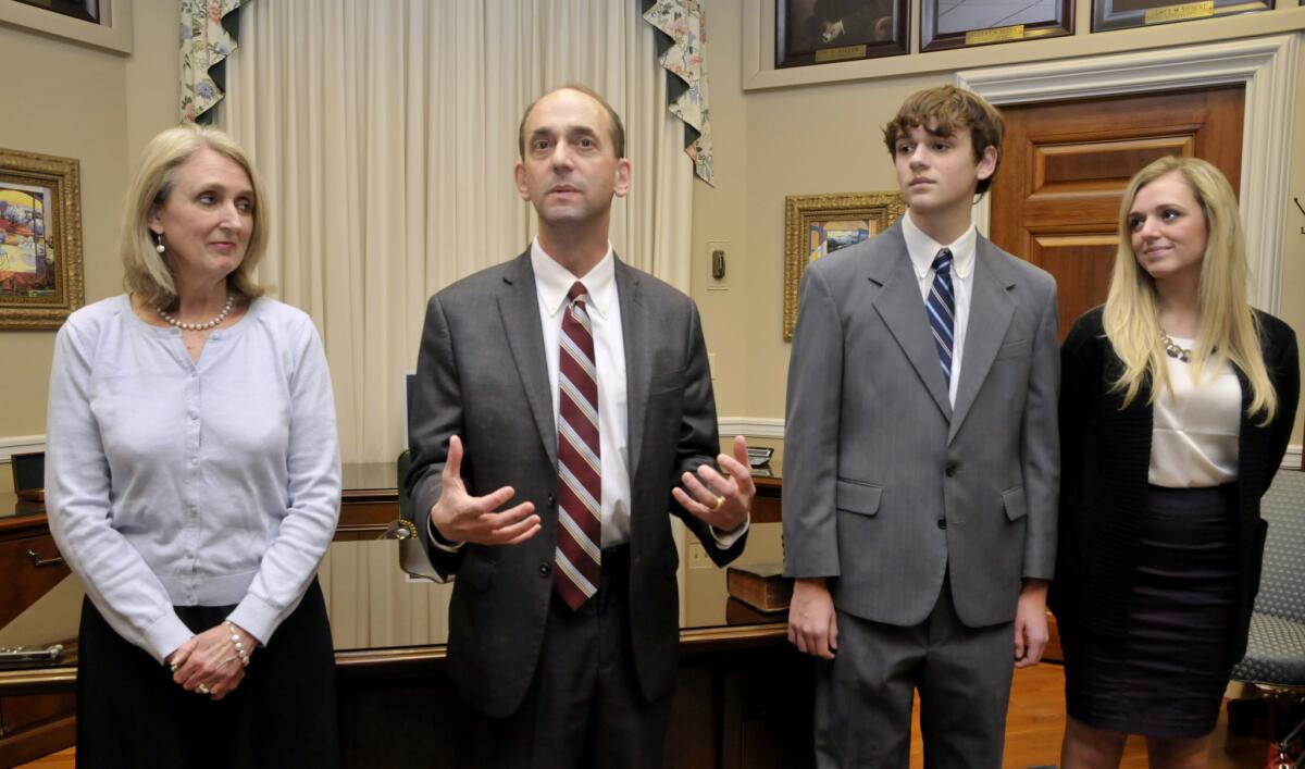 Tom Schweich, second from left, makes a few comments after his swearing-in ceremony Jan. 12, 2015, in his Capitol office in Jefferson City. At left is his wife, Kathy, and to his right are son Thomas Jr. and daughter Emile.