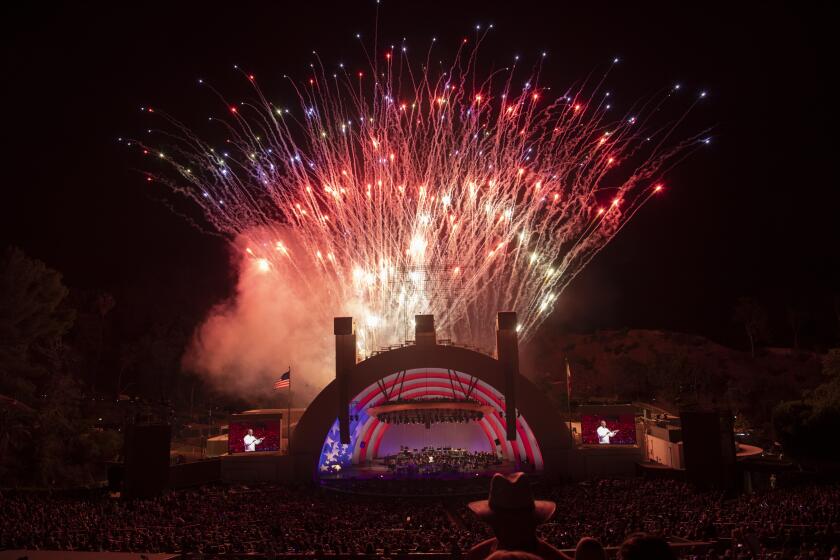 LOS ANGELES, CA - JULY 03: Fireworks light up the Hollywood Bowl during the first full-capacity concert in more than a year on Saturday, July 3, 2021. The night's performances were by the Hollywood Bowl Orchestra with Thomas Wilkins and Kool & the Gang. (Myung J. Chun / Los Angeles Times)
