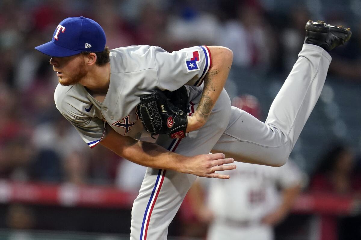 Texas Rangers starting pitcher A.J. Alexy throws to the Los Angeles Angels during the fourth inning of a baseball game Monday, Sept. 6, 2021, in Anaheim, Calif. (AP Photo/Marcio Jose Sanchez)