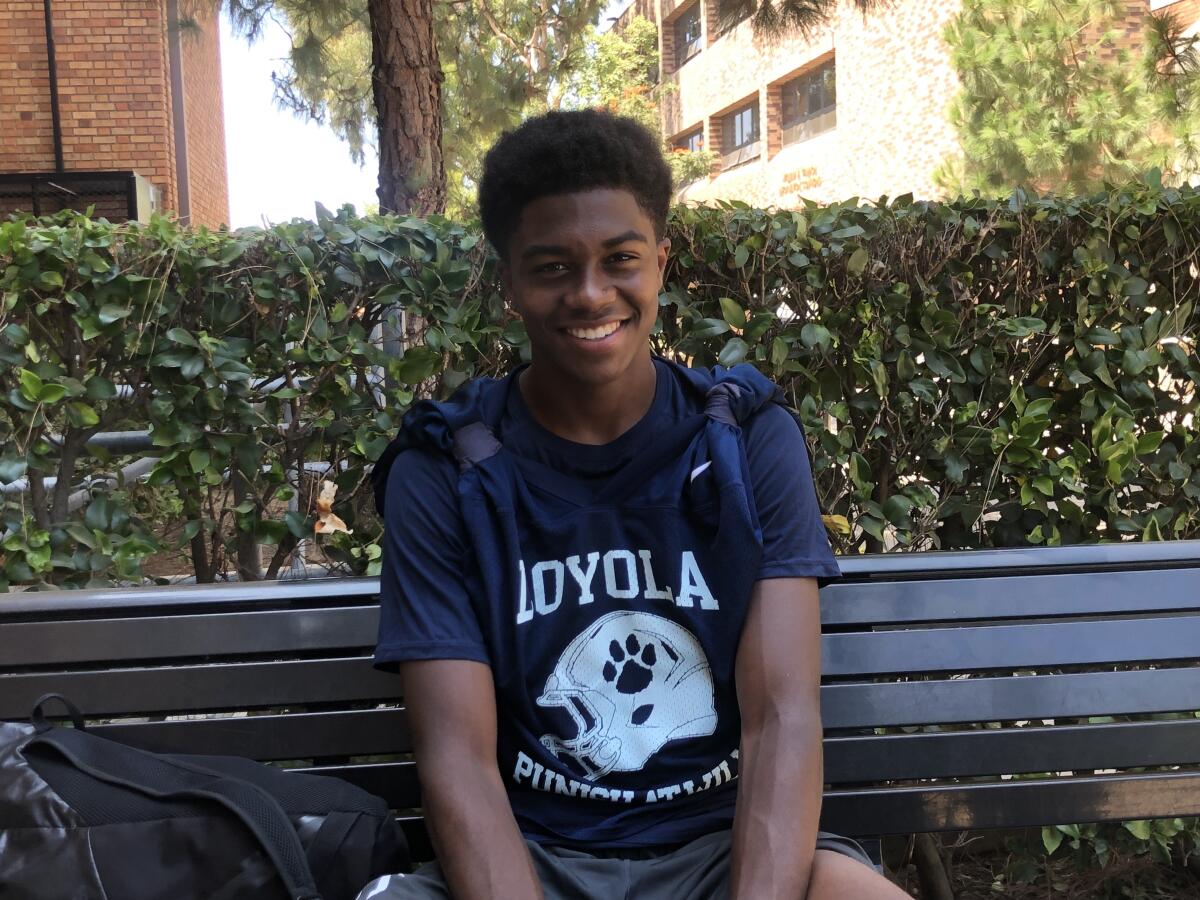 Loyola's Ceyair Wright sits on a bench.