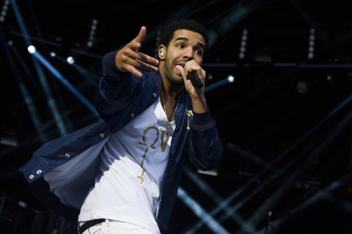 Tufts University is using the phrase "YOLO" as the basis for one of its application essays. Above, Canadian rapper Drake, who popularized the phrase in his song "The Motto," performs at a music festival in September 2012.