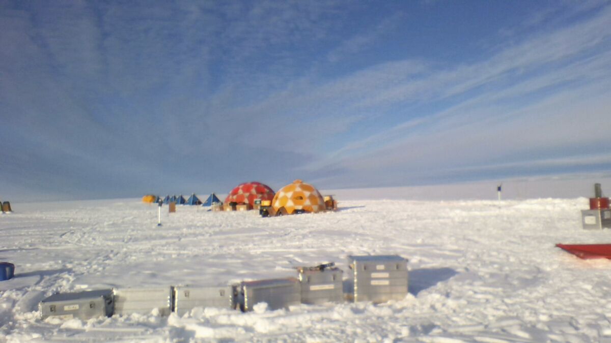 This photo provided by environmental scientist David Holland shows tents set up on the Dotson Ice Shelf in Antarctica on Monday, Jan. 31, 2022. A large iceberg broke off the deteriorating Thwaites glacier and along with sea ice it is blocking two research ships with dozens of scientists from examining how fast its crucial ice shelf is falling apart. The smaller Dotson ice shelf is about 87 miles (140 kilometers) west of the Thwaites ice shelf. (David Holland via AP)