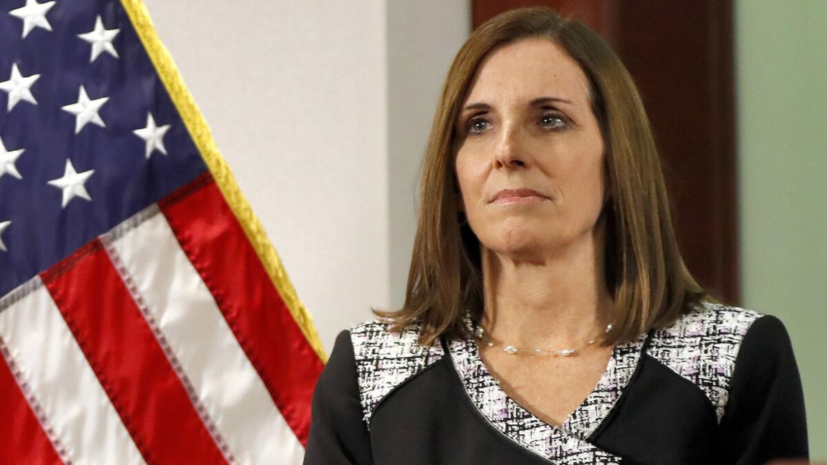 As a House member in December 2018, Martha McSally waits to speak during a news conference in Phoenix.