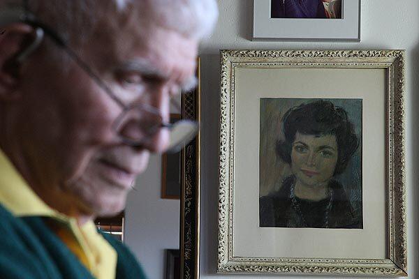 Alan Purdy, 88, is shown in front of a painting of his late wife, Margaret. He sat by while she took her own life March 20; but San Diego County sheriff's deputies determined there was sufficient evidence to support arresting him on a charge of assisting a suicide, a felony. The district attorney's office is reviewing whether to file a criminal charge against Purdy.