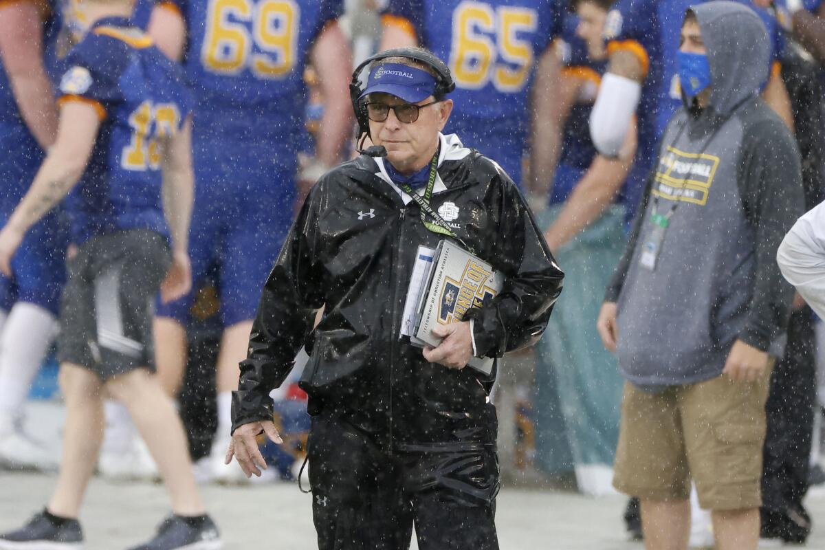 FILE - South Dakota State head coach John Stiegelmeier watches his team play against Sam Houston State during the first half of the NCAA college FCS Football Championship in Frisco, Texas, Sunday May 16, 2021. North Dakota State and South Dakota State have been playing football against each other since 1903. The Missouri Valley Football Conference rivals are playing for so much more on Sunday, Jan. 8, 2023 in North Texas, nearly 1,000 miles from the North Dakota-South Dakota border. (AP Photo/Michael Ainsworth, File)