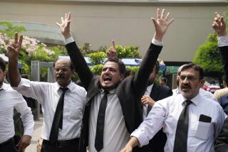 Lawyers and supporters of Pakistan's former Prime Minister Imran Khan chant slogans against the court decision at his residence, in Lahore, Pakistan, Saturday, Aug. 5, 2023. Pakistani police on Saturday arrested former Prime Minister Khan at his home in the eastern city of Lahore. It’s the second time the popular opposition leader has been detained this year.(AP Photo/K.M. Chaudary)