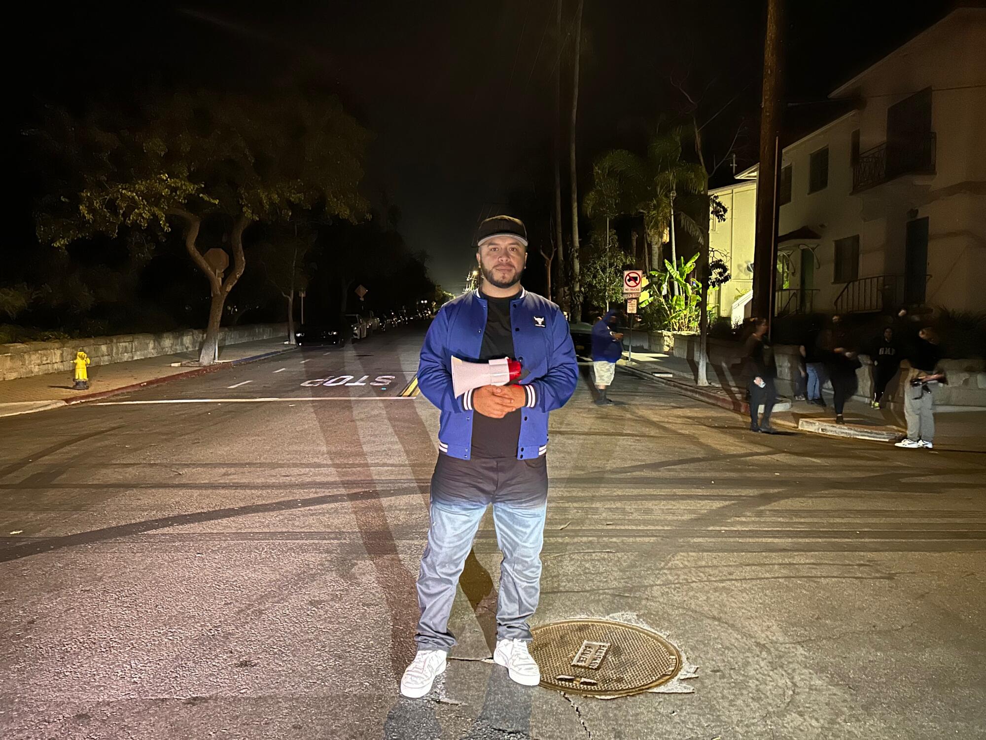 Activist Edin Alex Enamorado stands at an empty Santa Barbara intersection 